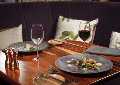 Suesey Street- Corner Table Booth in Dining Room with Food and Wine