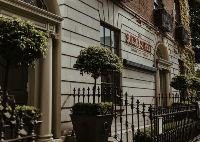 Suesey Street- Exterior Shot of Building and Restaurant Sign