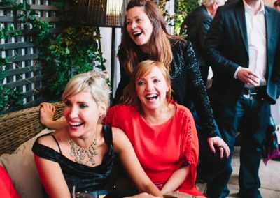 Suesey Street- Wedding Guests Laughing on Terrace